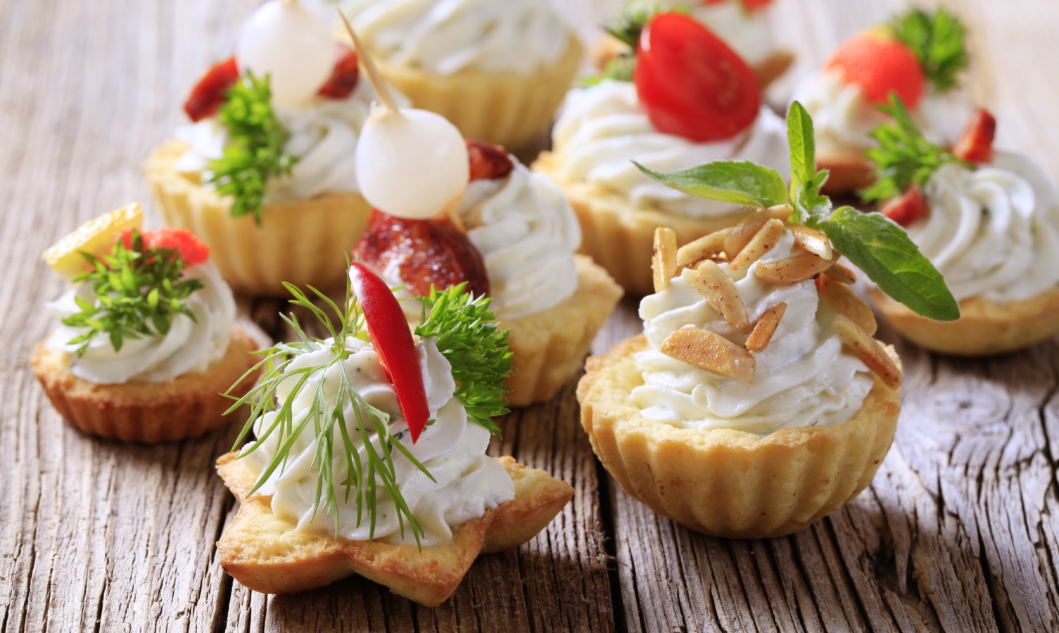 Variety of pastry-based canapes with various toppings