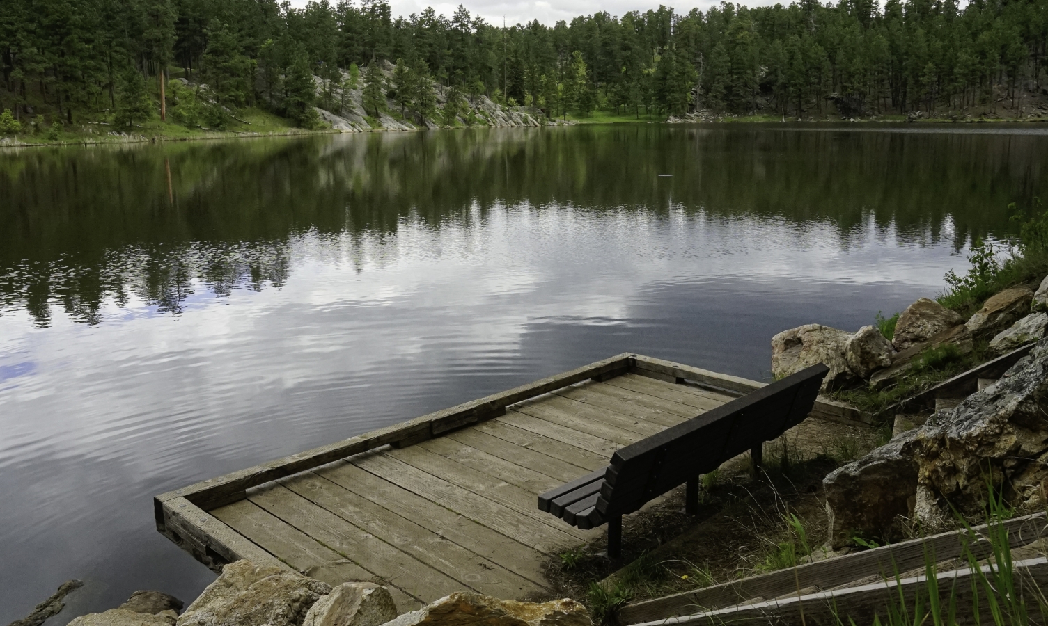 Horsethief Lake, a small manmade lake that was created in the 1930’s when Franklin D. Roosevelt’s Civilian Conservation Corps built a dam on Pine Creek. It’s located right next to Mount Rushmore in South Dakota and offers paths and areas for fishing and camping.