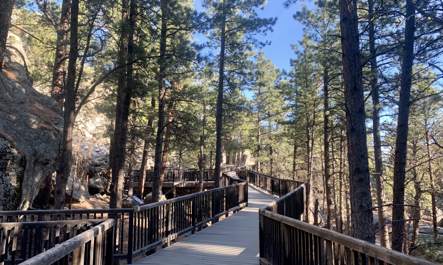 Wooden boardwalk with railings at the Presidential Trail at Mount Rushmore in South Dakota